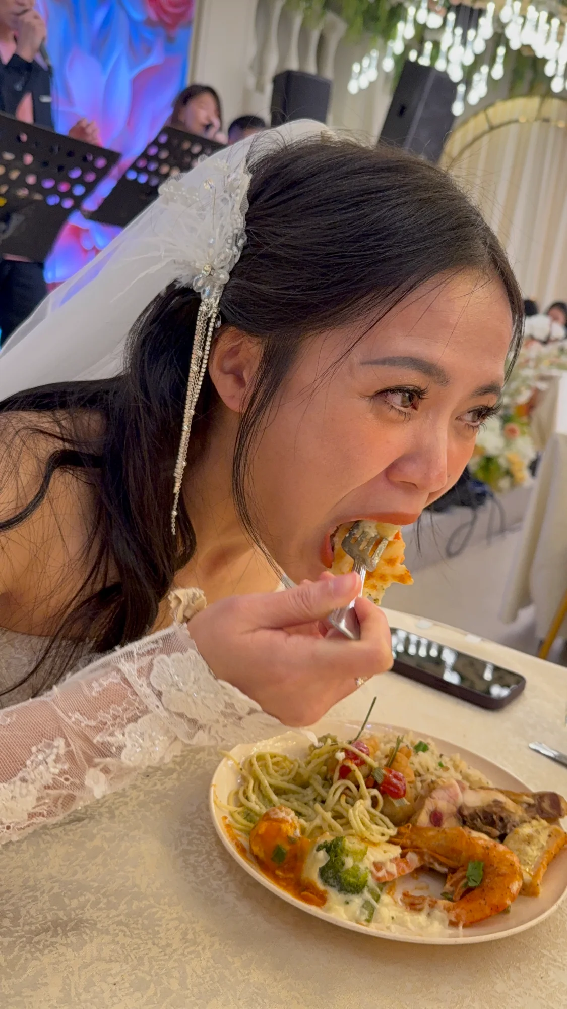 Bride eating at wedding