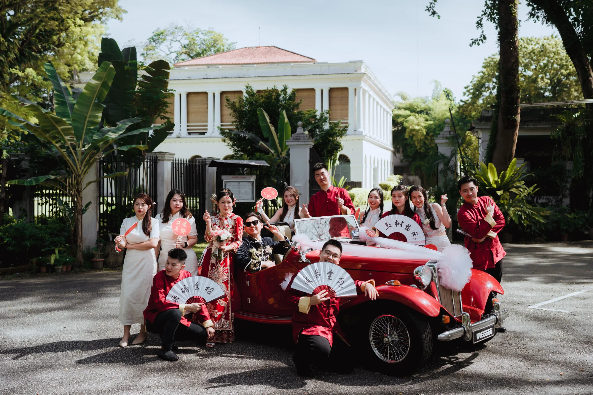 Wedding party with vintage car